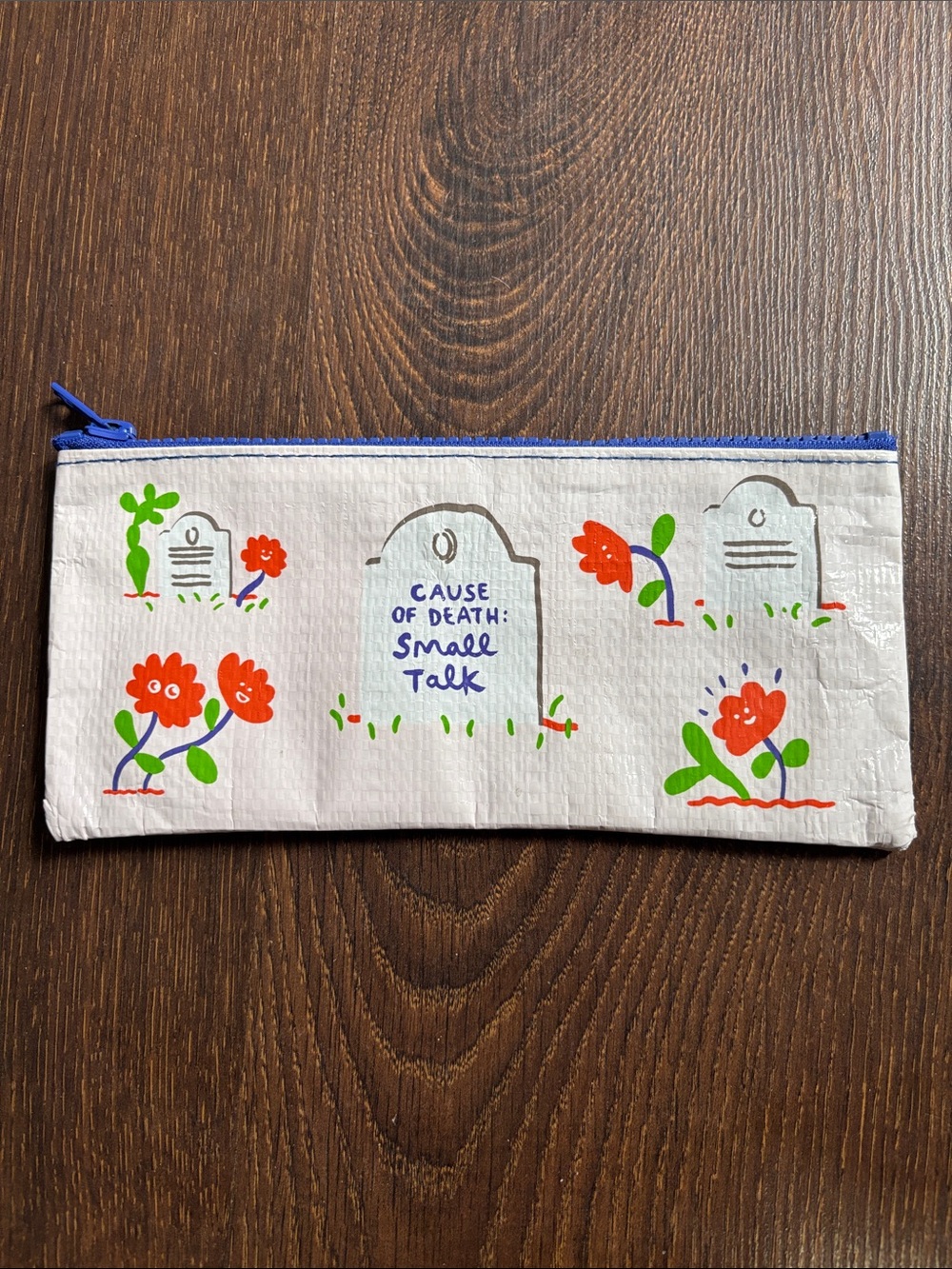 Blue Q White Pouch with Bold Blue Zipper and Red Accent Print